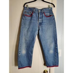 Jet repurposed, intentionally distressed, Levi's light wash cropped jeans with v